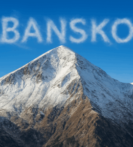 Връх Вихрен, втори по височина връх в Пирин планина, виден от Банско със снежна шапка и драматични скалисти склонове под ясно синьо небе