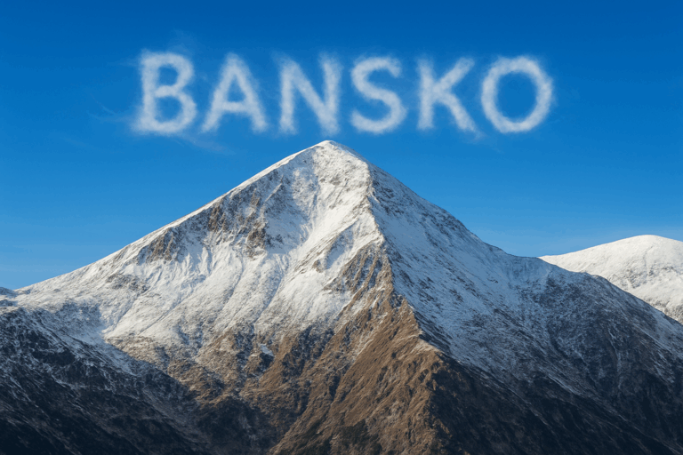 Vihren Peak, the second highest peak in the Pirin Mountains, visible from Bansko with a snow cap and dramatic rocky slopes under a clear blue sky