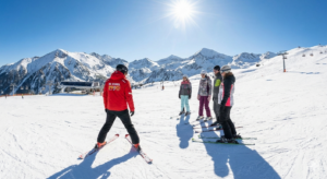 A group of beginner skiers with an instructor at Banderishka Polyana in Bansko.