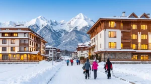 Cozy winter view of Polezhan Street in Bansko overlooking the White Lavina and Elegant Lux hotels and the Pirin Mountains.