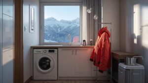 Compact washing machine and dryer installed in a small apartment in Bansko with a view of Pirin Mountain.