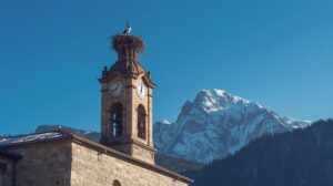 The bell tower of the Holy Trinity Church in Bansko against the backdrop of the Pirin Mountains