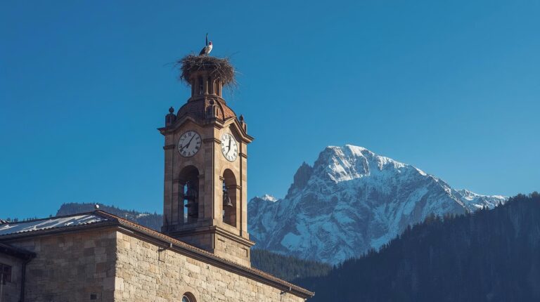 The bell tower of the Holy Trinity Church in Bansko against the backdrop of the Pirin Mountains