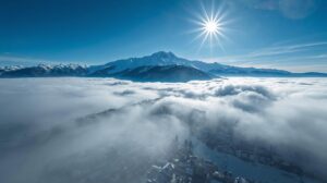 Temperature inversion in Bansko – sunny slopes above the clouds and fog in the city.