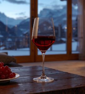 Чаша червено вино в спа хотел в Банско на фона на заснежена планина