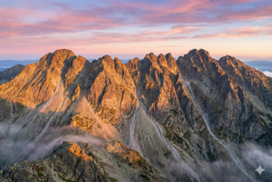 Climbers traverse the sharp rocky edge of the Strazhite Traverse in the Pirin Mountains.