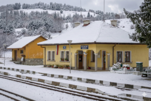 Winter panorama of Avramovo station, the highest railway station in the Balkans, covered in deep snow.
