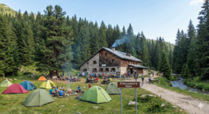 Banderitsa Hut in Pirin with tent camp and forest