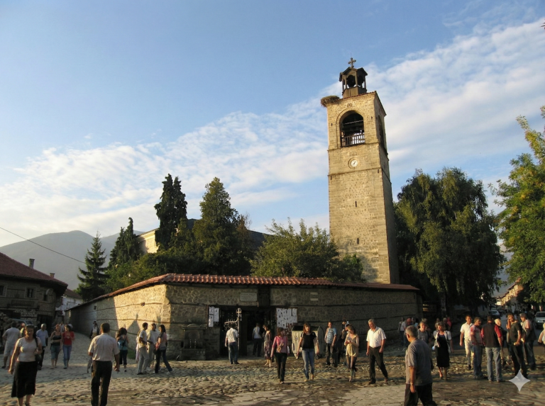 Holy Trinity Church in Bansko with the bell tower against the backdrop of Pirin Mountain
