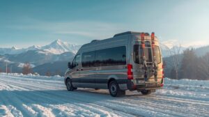Traventuria minibus for transfer to Bansko with the snow-capped Pirin Mountain in the background