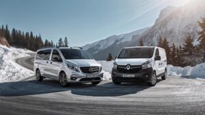 Professional minibuses for transfers to Bansko on a snowy mountain road.